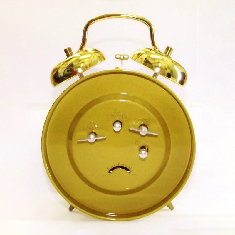 Réveil mécanique doré vintage